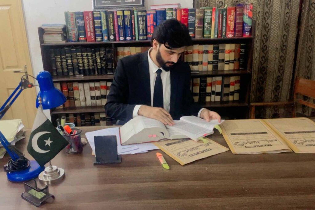 Expert lawyer study the case at table of his azeem bajwa.